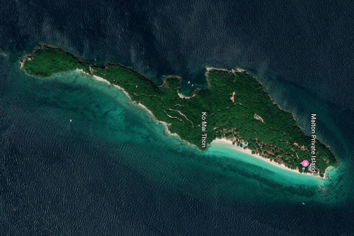 Satellite map view of a wooded island labelled Ko Mai Thon with white beach