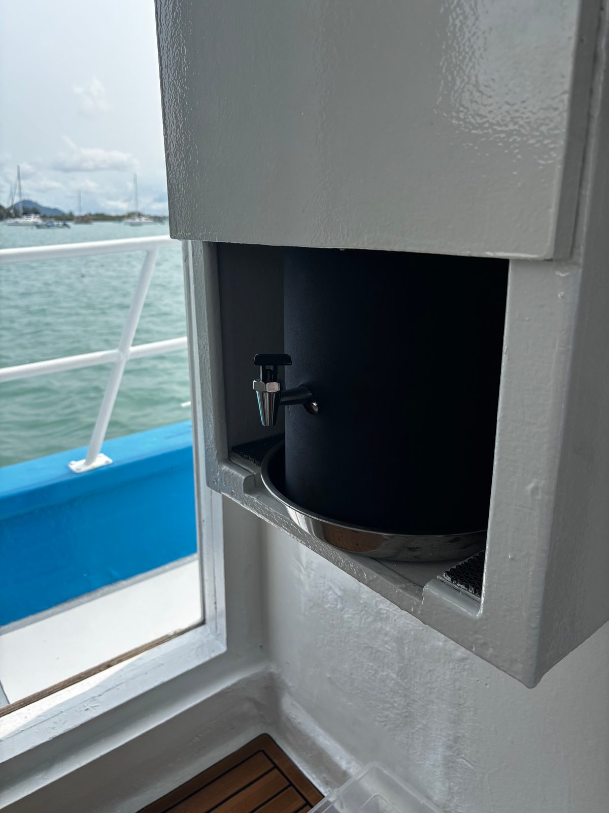 The drinking-water dispenser built into the saloon wall