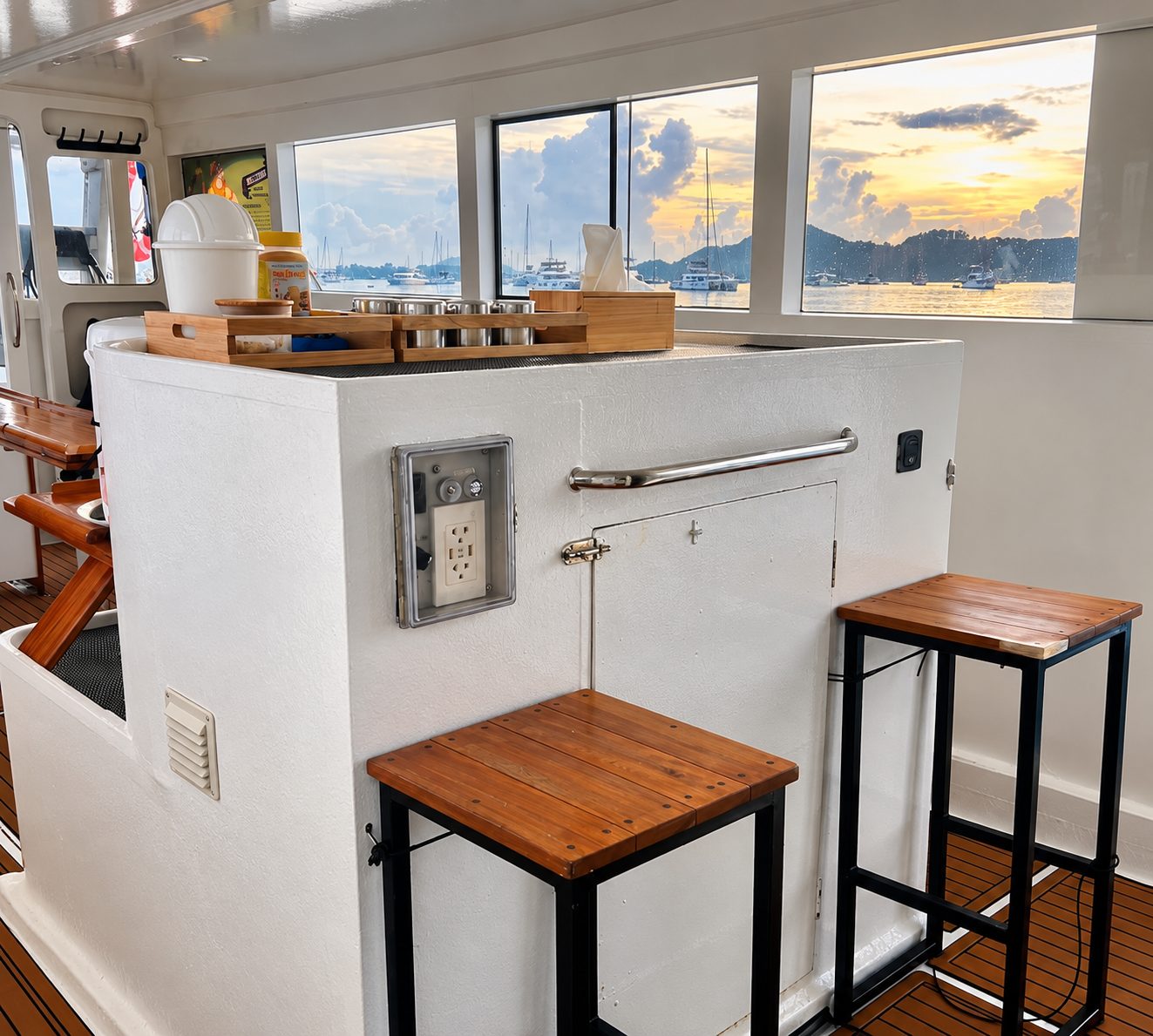 Two tall stools at the saloon counter, the bay through the windows