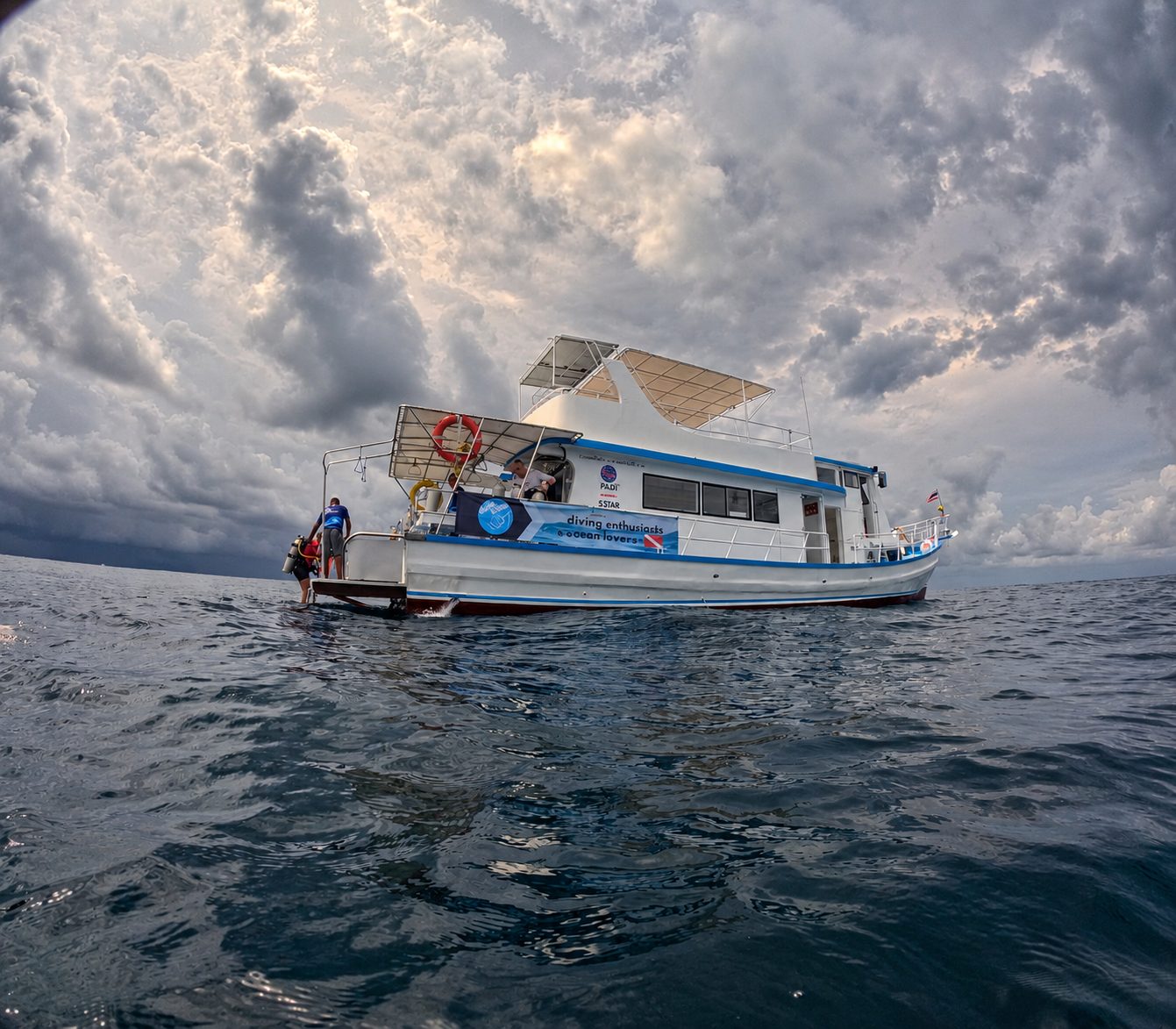 MV Matchanu on open water under towering clouds