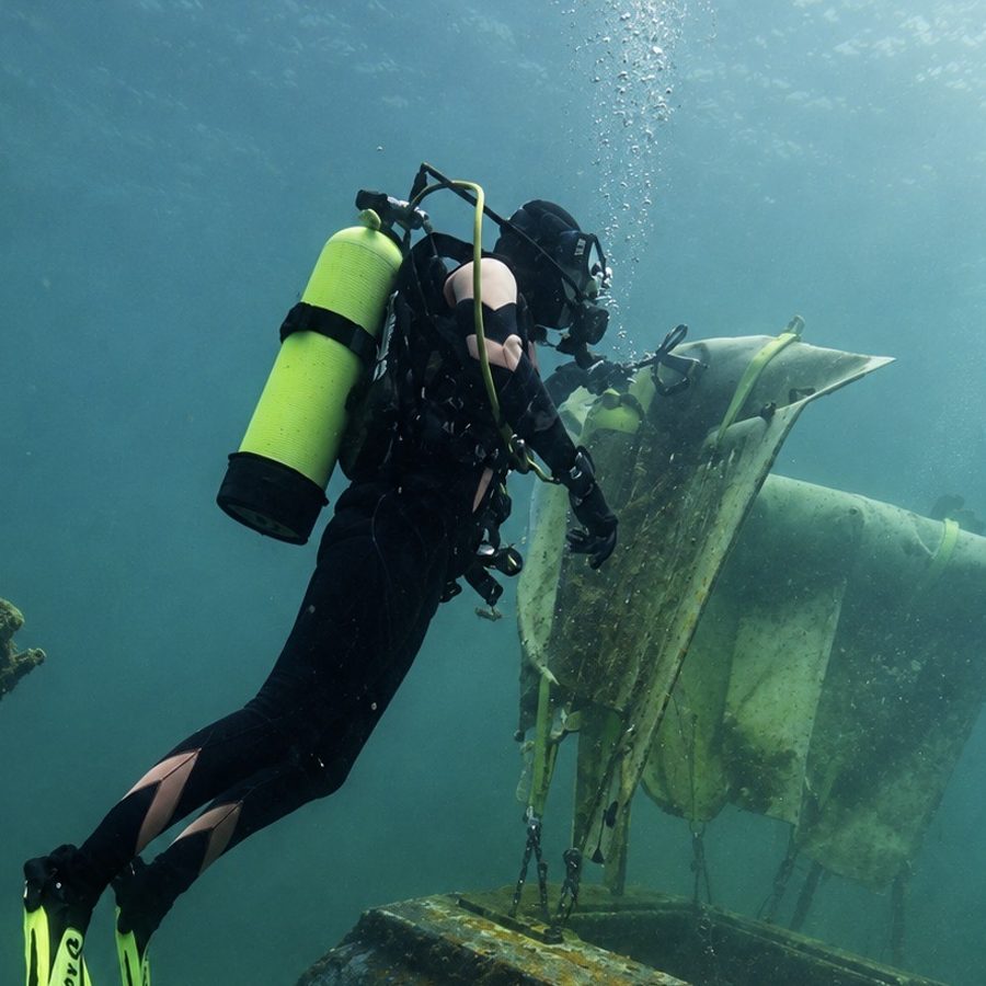 A diver lifting an object with a lift bag (PADI)