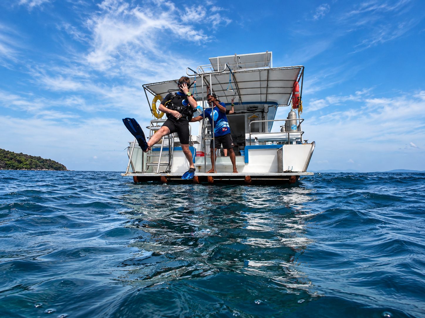 Students on the dive platform of MV Matchanu, seen from the water