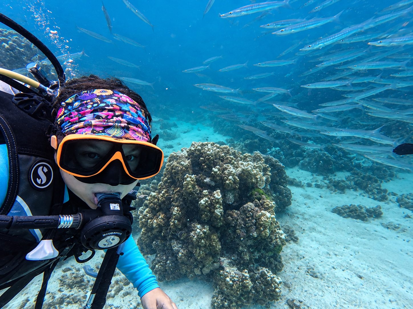 A diver beside a coral head, close to the camera
