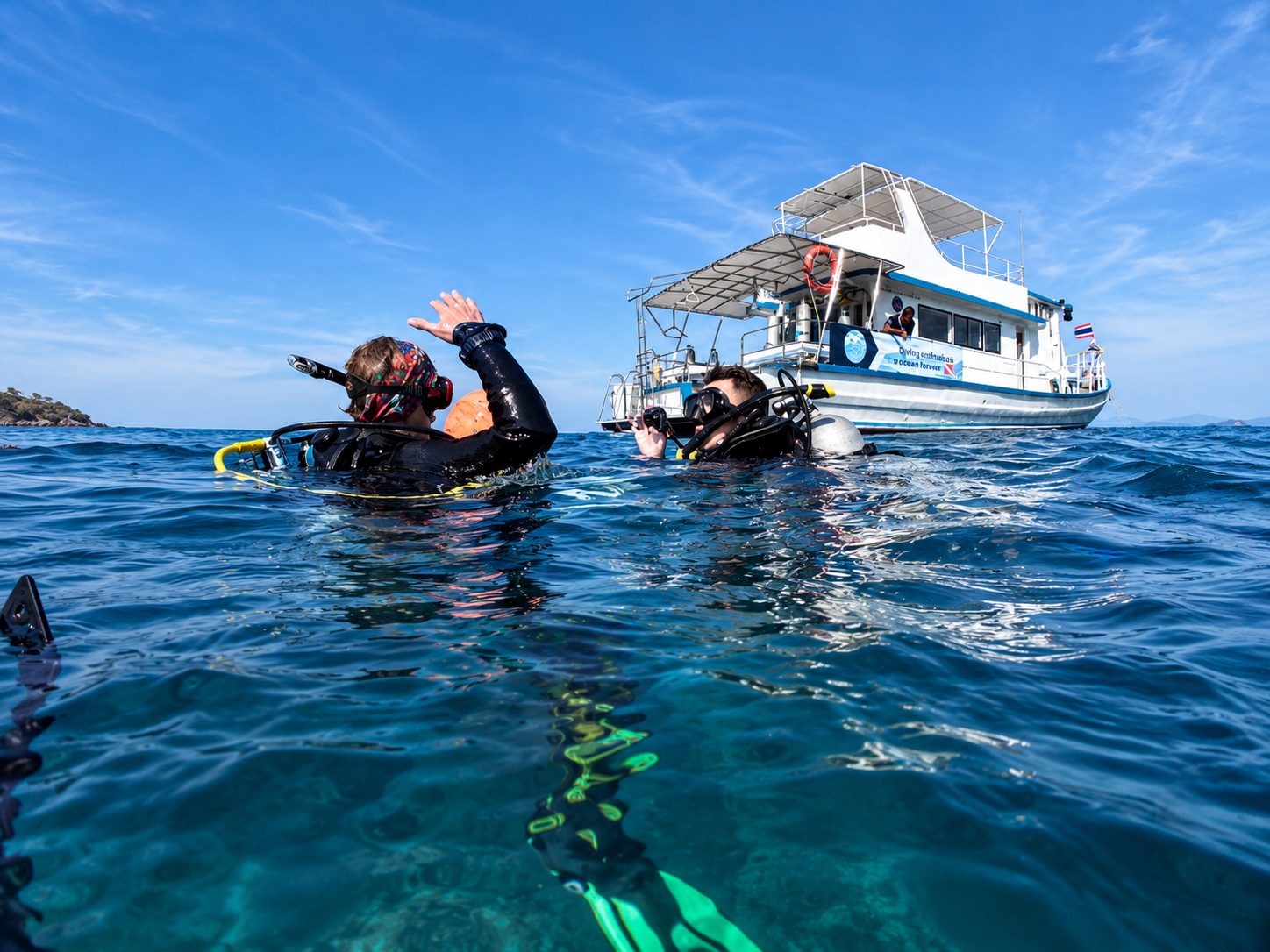 Divers at the surface beside MV Matchanu