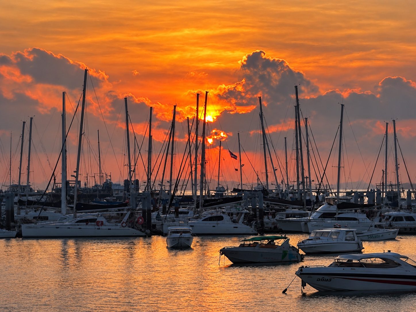 Sunrise over the masts of the Chalong marina