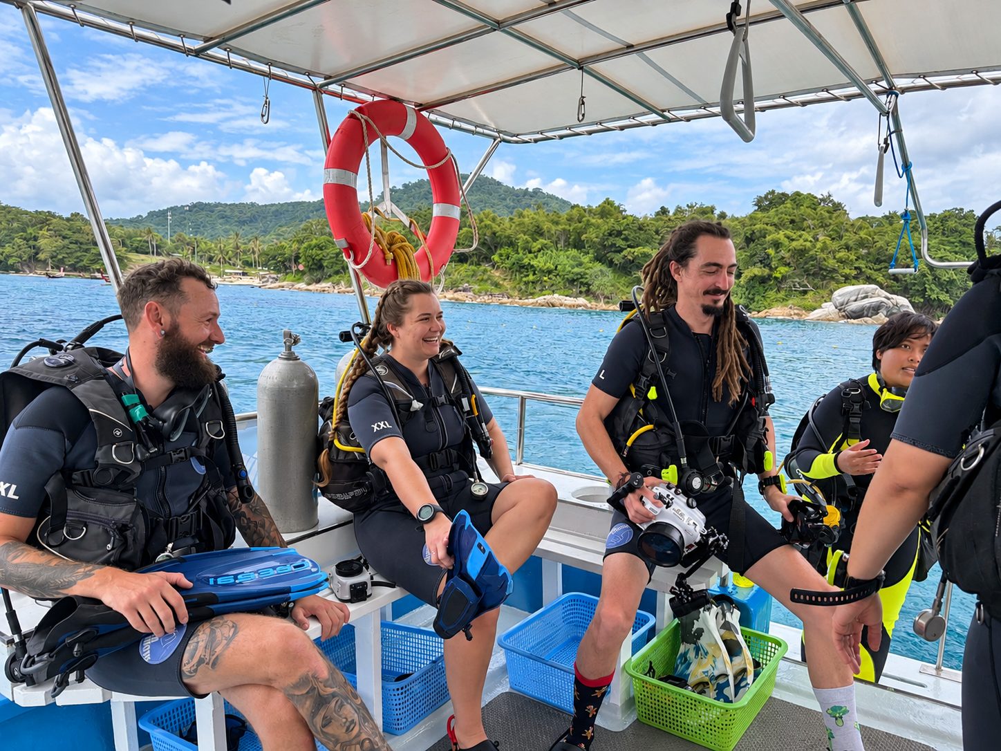 A group kitting up on the dive deck of MV Matchanu