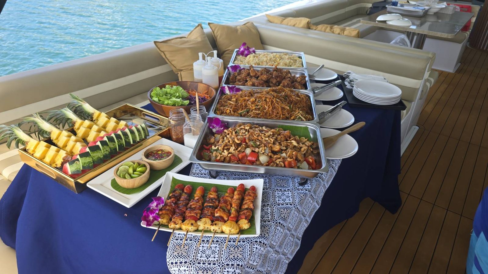 Dishes laid out on a table on the deck of a boat